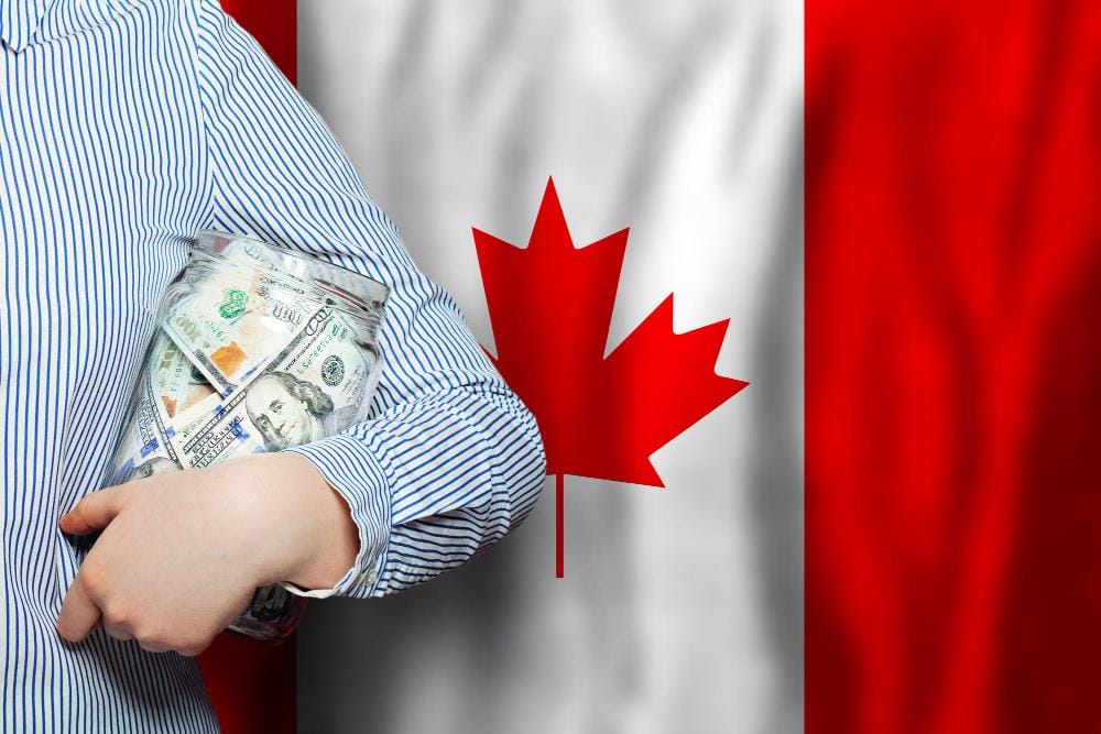 American Dollar banknotes on national Canadian flag American Dollar banknotes on national Canadian flag