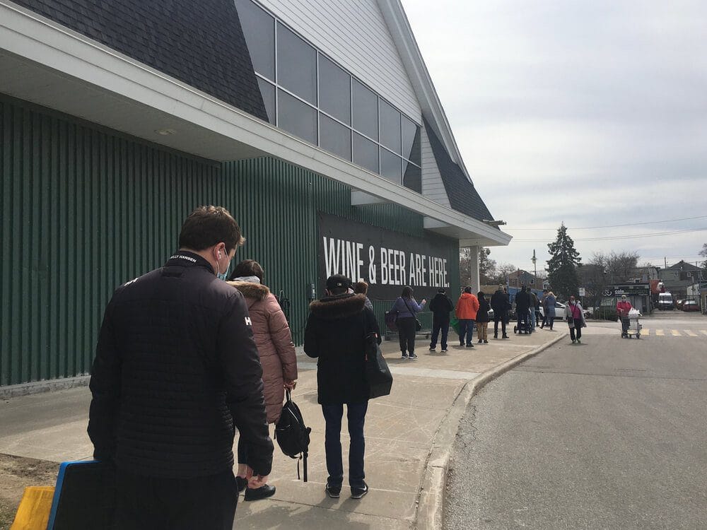 People line up outside Loblaws grocery store during Ontario 3rd wave lockdown in Toronto Canada People line up outside Loblaws grocery store during Ontario 3rd wave lockdown in Toronto Canada