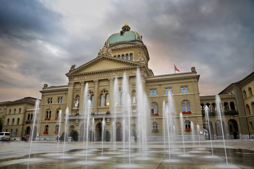 Swiss Parliament building through fountain. Bern.Switzerland Swiss Parliament building through fountain. Bern.Switzerland